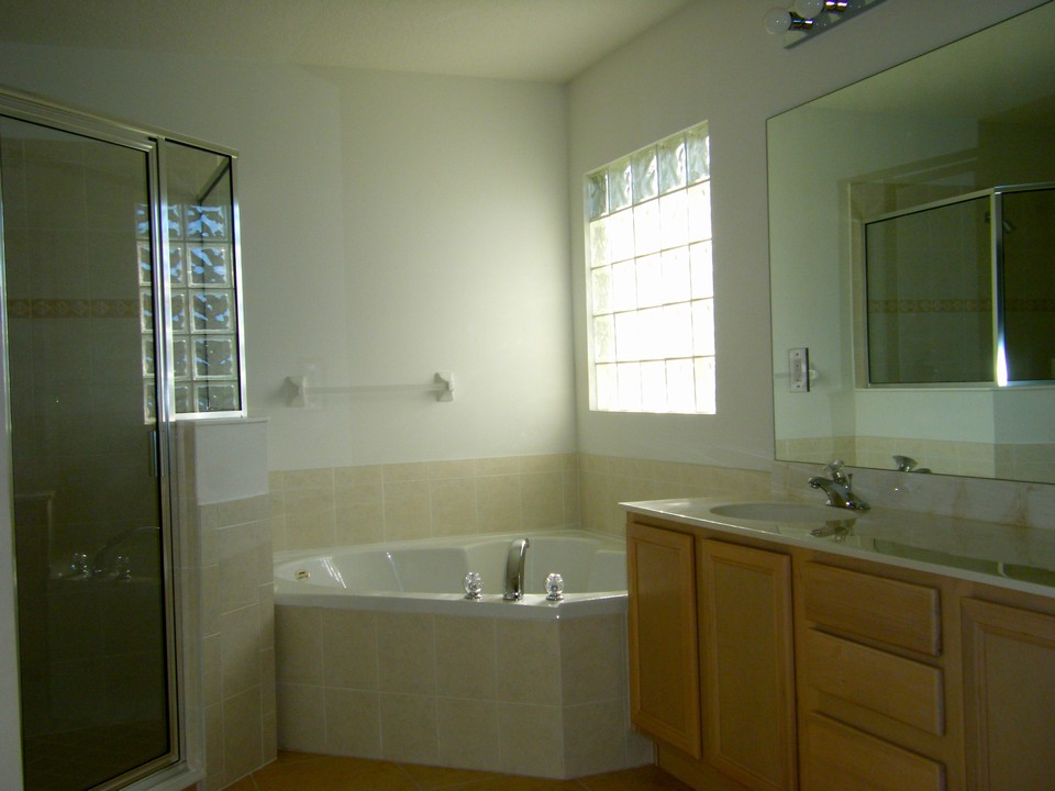 master bath with roman tub, separate shower & his/her sinks