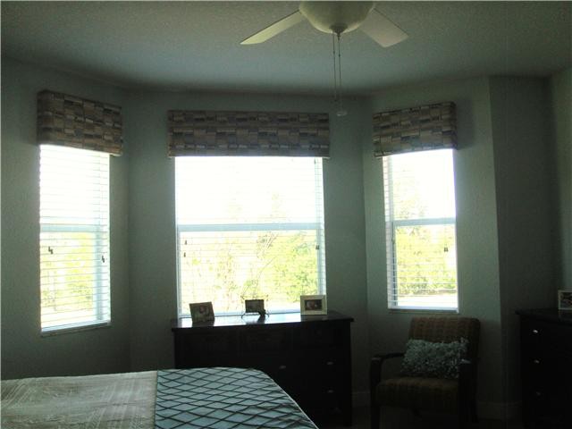 master bedroom with bay window