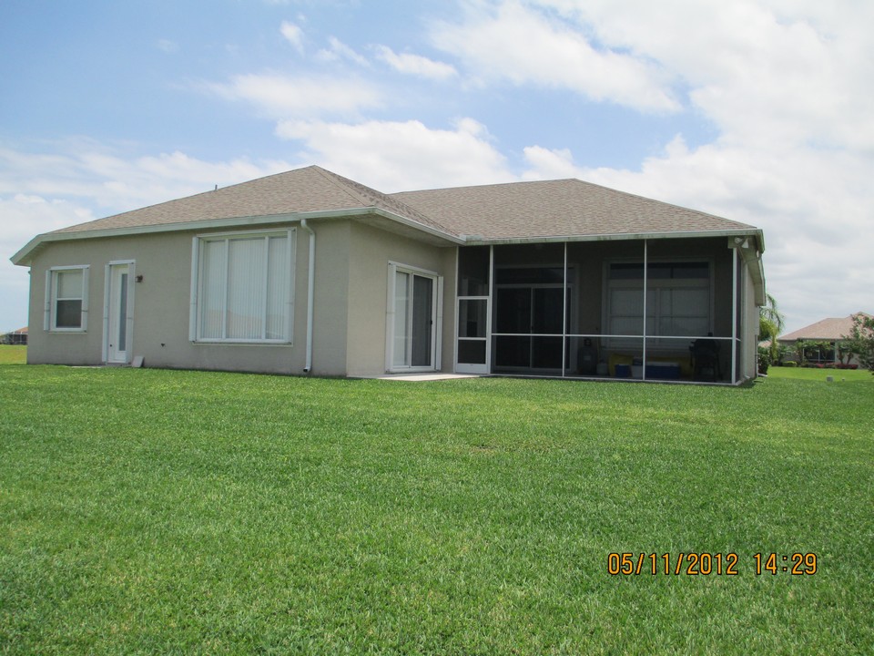 backyard and covered screened patio