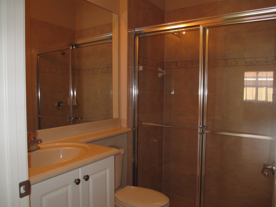 guest bath on first floor with shower & raisted counter