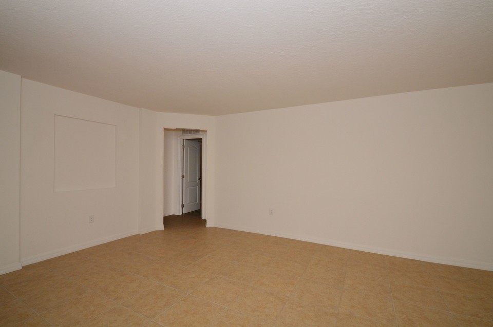 living room with hallway to master bedroom