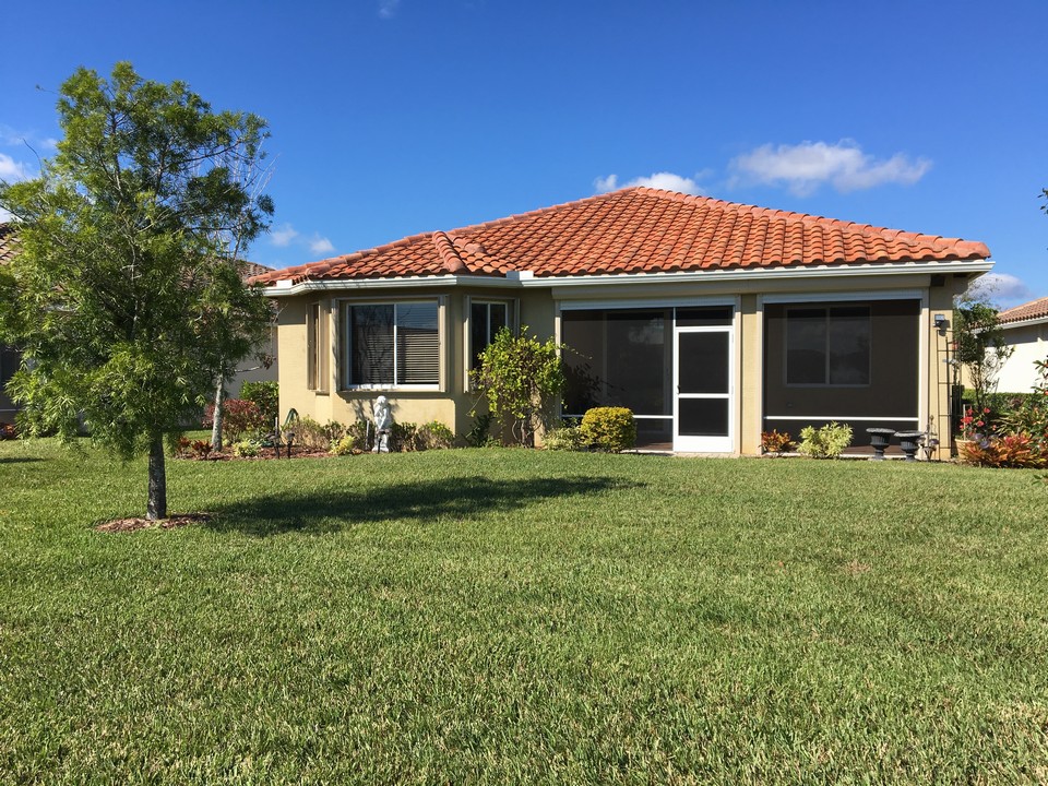 back view of house with screened patio