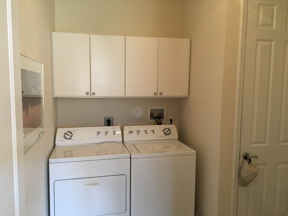 laundry room with cabinets