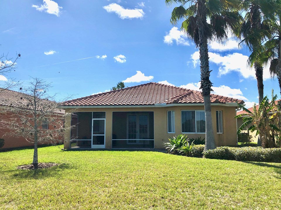 back view with tropical landscaping