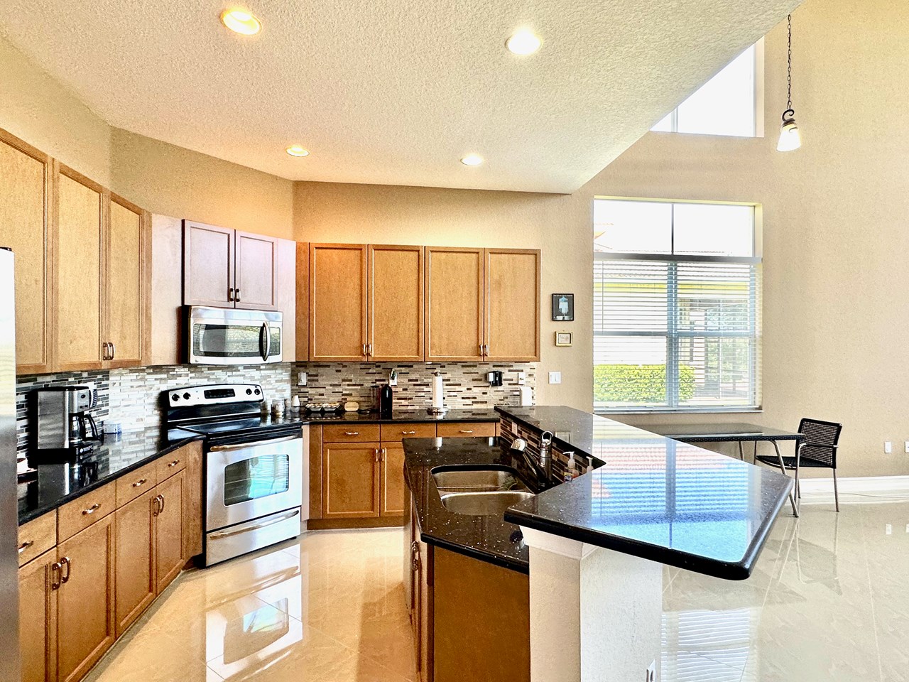 kitchen with granite and tile backsplash