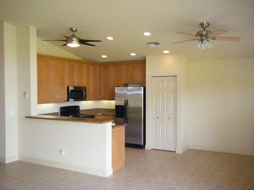 kitchem with snack counter & stainless appliances