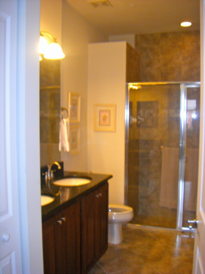master bath, his/her sinks, floor to ceiling shower tiles