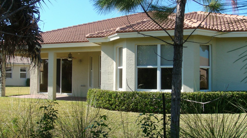 rear view with covered patio, and bay window from master bedroom