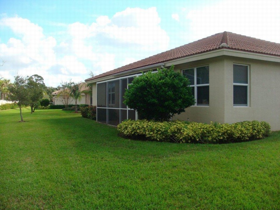 back view with extended screened patio