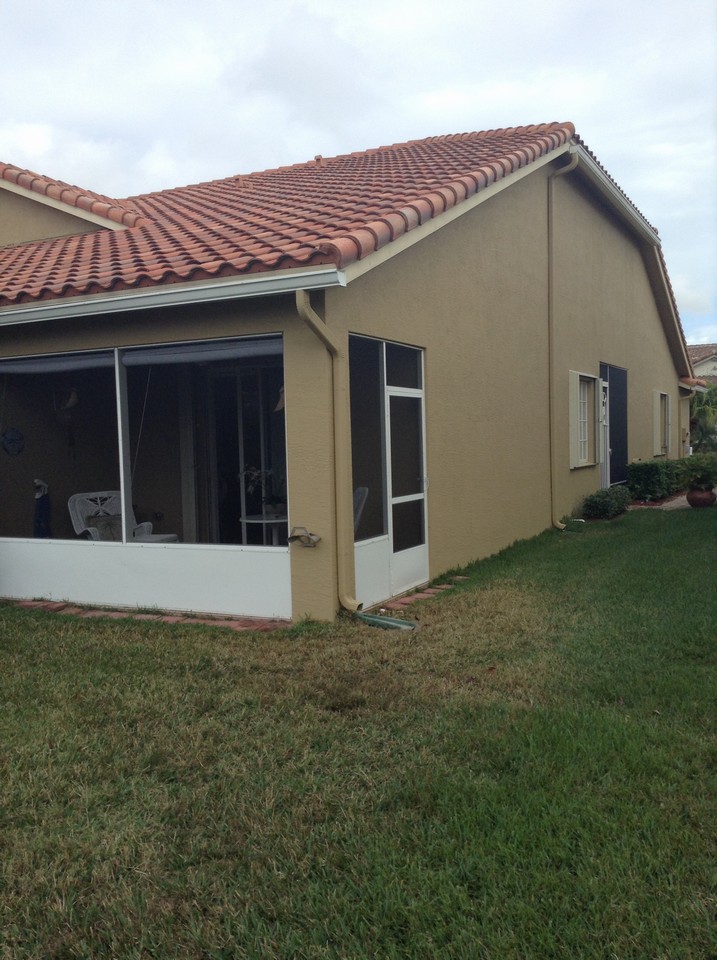 back view of villa and screened covered patio