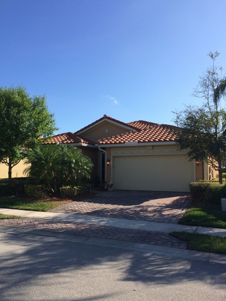 front of house with tile roof