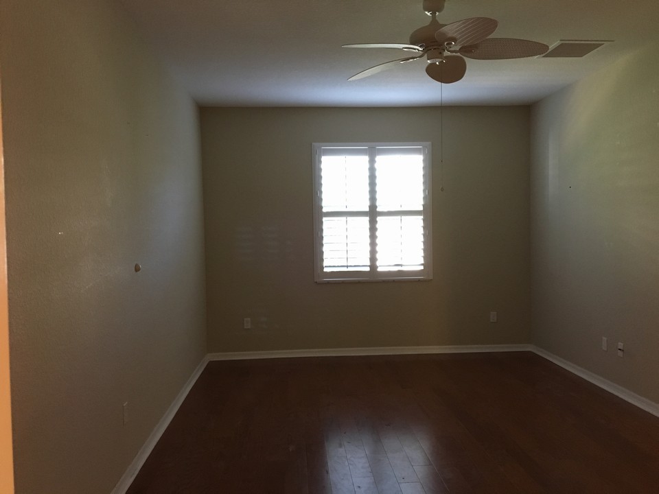 master bedroom, wood flooring & plantation shutters