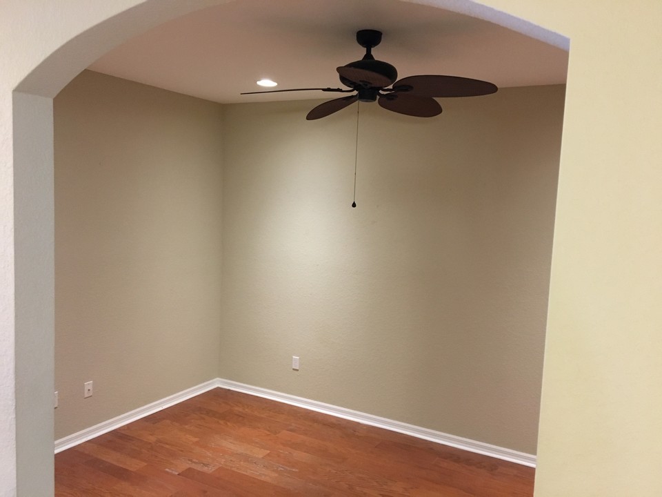 den/office with wood flooring