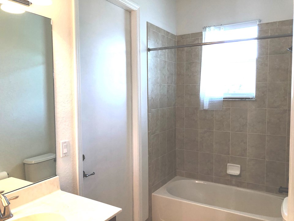 guest bath with cabana door to patio