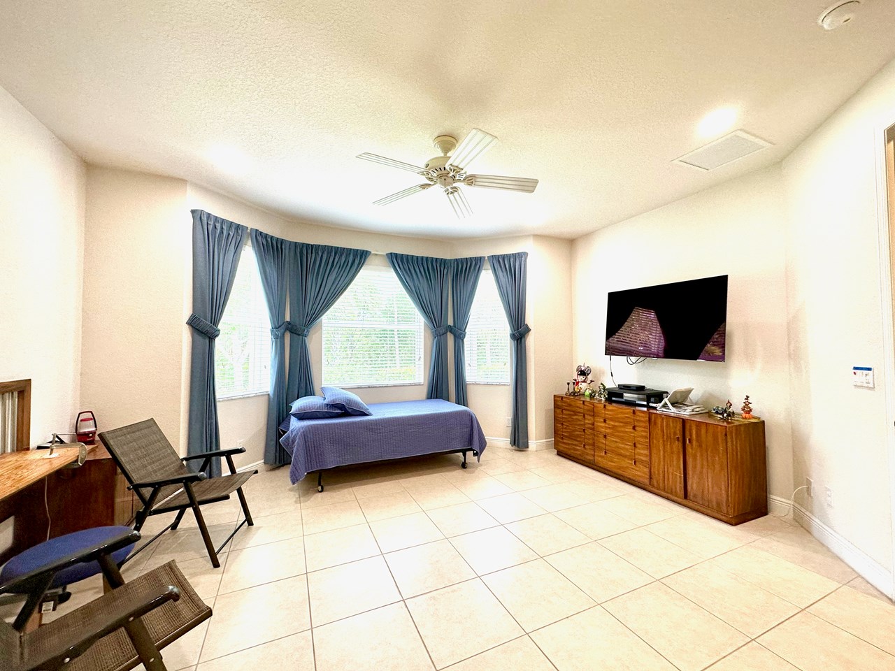 master bedroom with bay window and preserve outside!