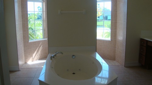 master bath jacuzzi tub, sports shower, his & her sinks
