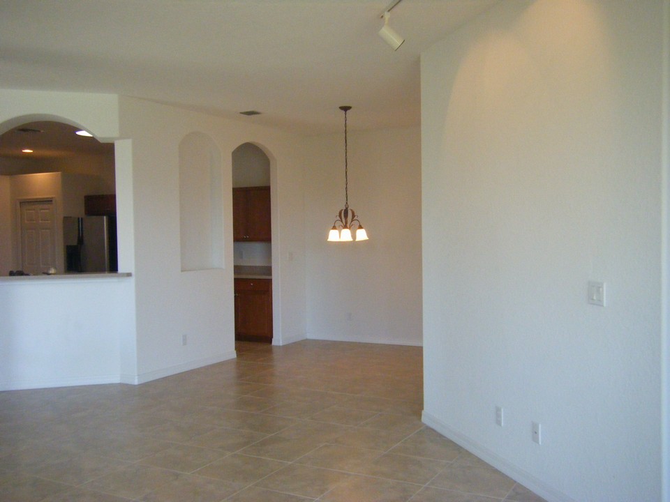looking from living room towards dining room and kitchen