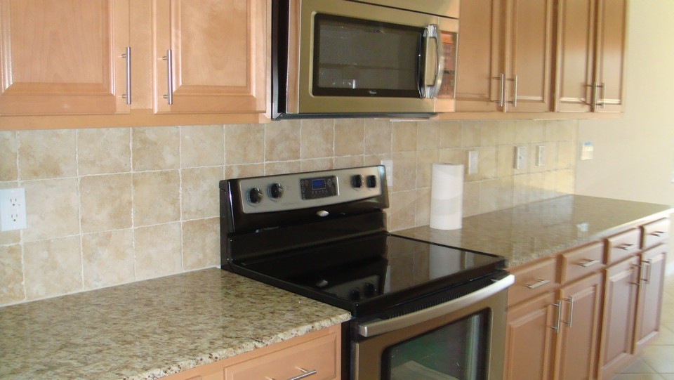 ss appliances, tile backspash & granite counters