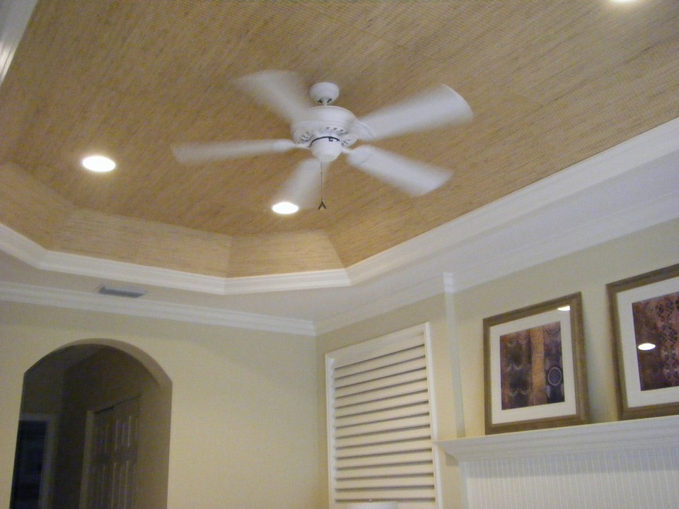 tray ceiling in master bedroom with crown molding & hi-hats