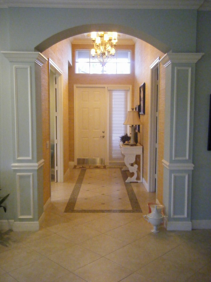 foyer entrance with glass mosaic tile in lays