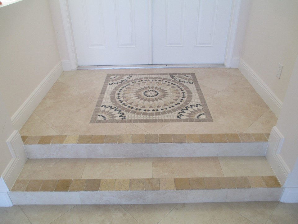 foyer with double doors and custome tile-work