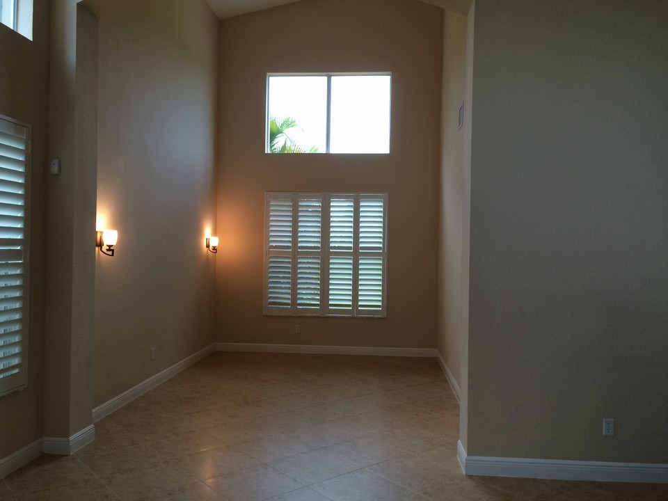 formal dining room, plantation shutters and sconces