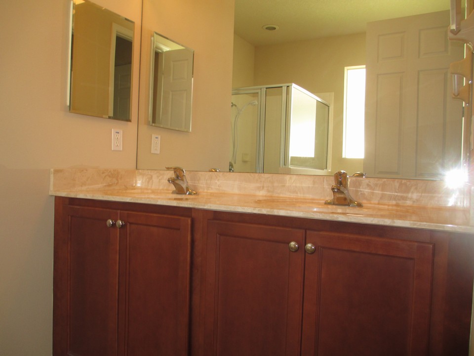 master bath with his/her sinks, rasied counters