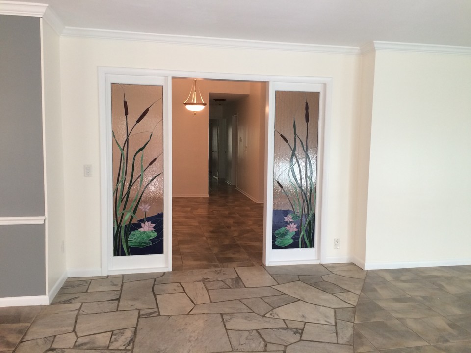 custom glass doorway leads to family room