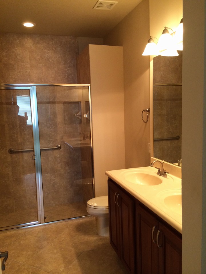 master bath, floor to ceiling tile in shower, double sinks