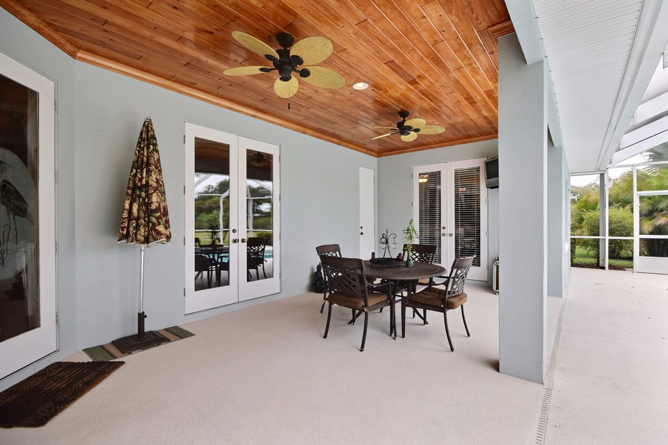 covered patio with wood ceiling