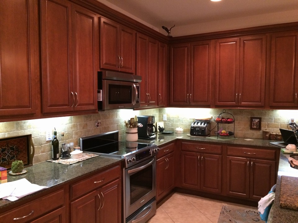 cherry cabinets, under mount lights, upgraded appliances