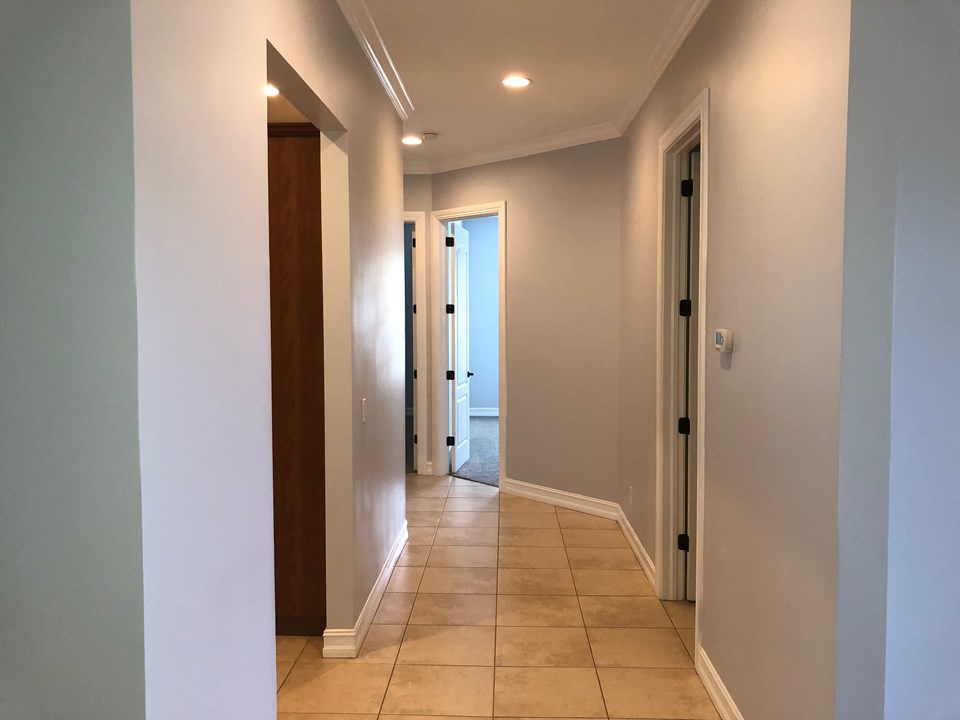 hallway to laundry room and bedrooms