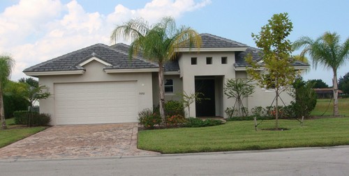 front of house with paver driveway & walkway