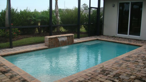 waterfall pool with view of guest house