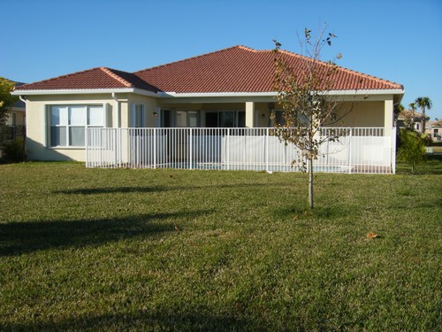 large backyard with fenced pool & child safety fence