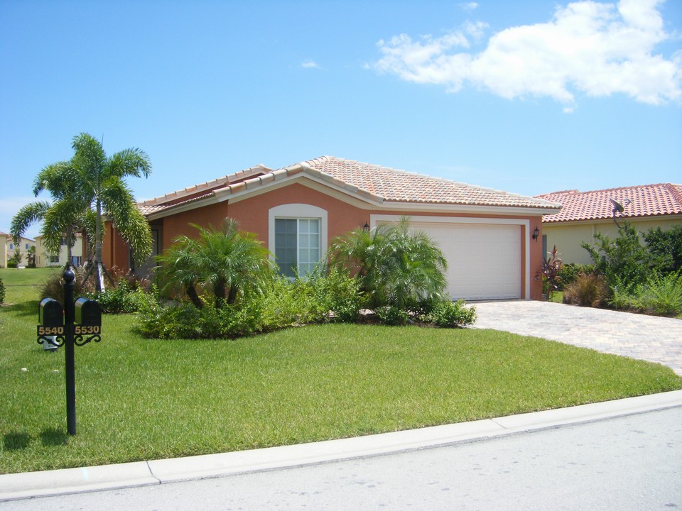 front view of house with paver driveway