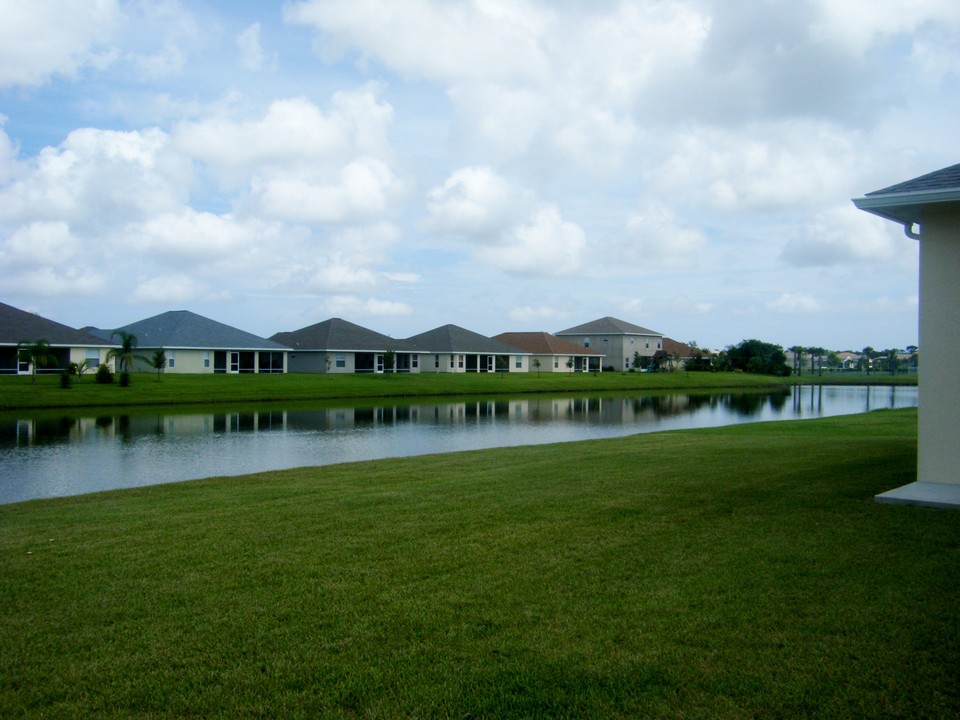 view from backyard, family room, living room & master bedroom