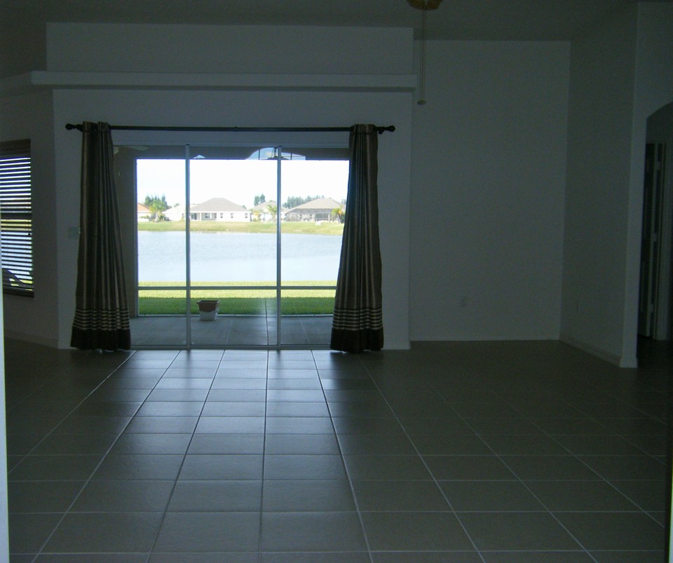 family room with sliders opening to screened patio