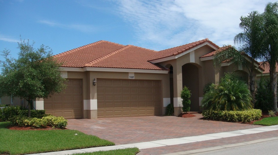 back view of house looking at covered patio