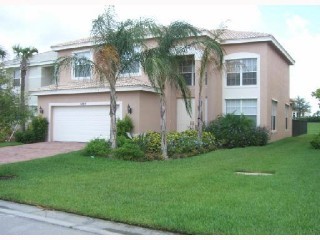 front of house with paver driveway and walk-way