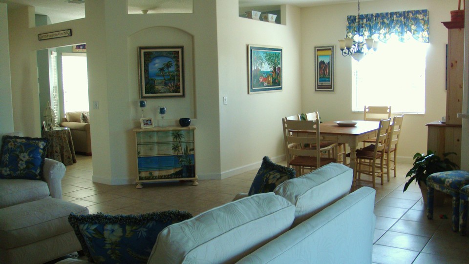 view from living room looking to dining room and den