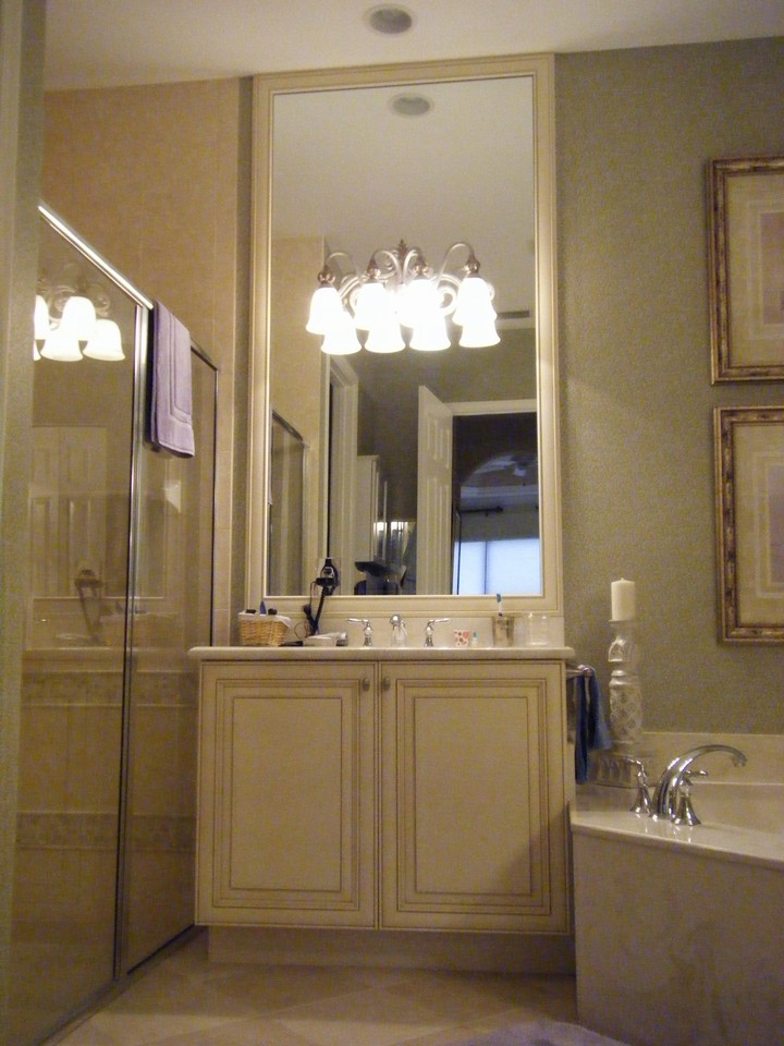 master bath with shower enclosure, framed mirror to ceiling