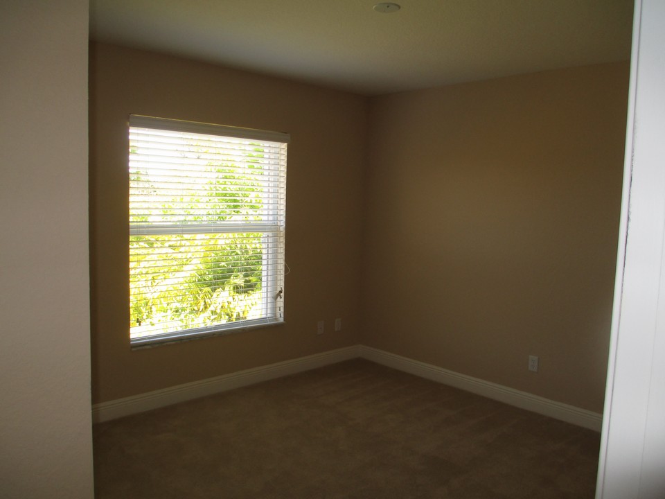 bedroom with view of backyard