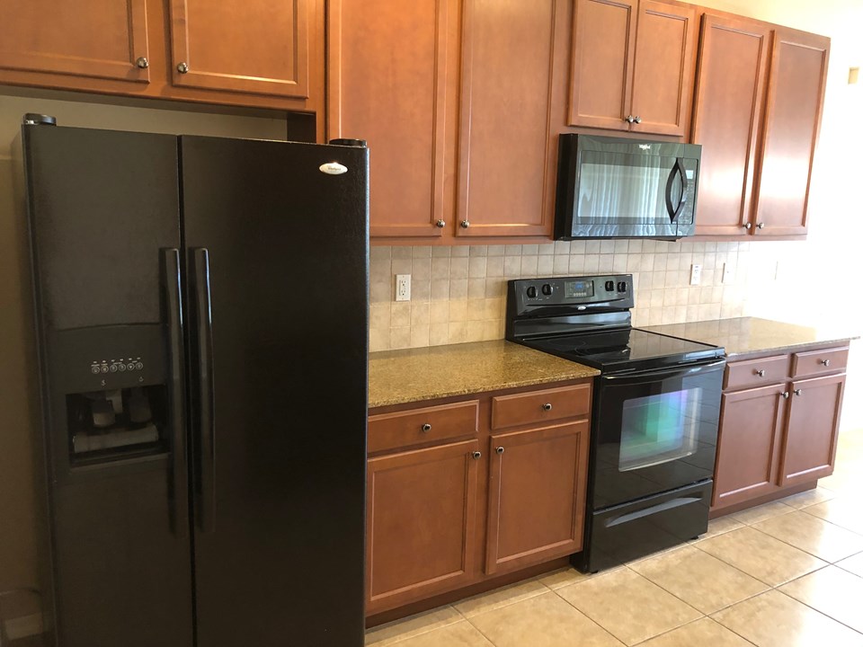 maple cabinets, tile backsplash