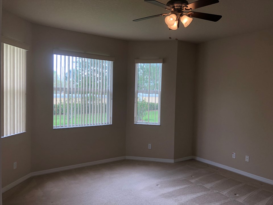 master bedroom with bay window