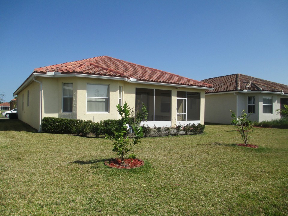 back view with covered screened patio