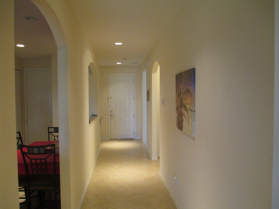 foyer looking towards front door, kitchen on the left