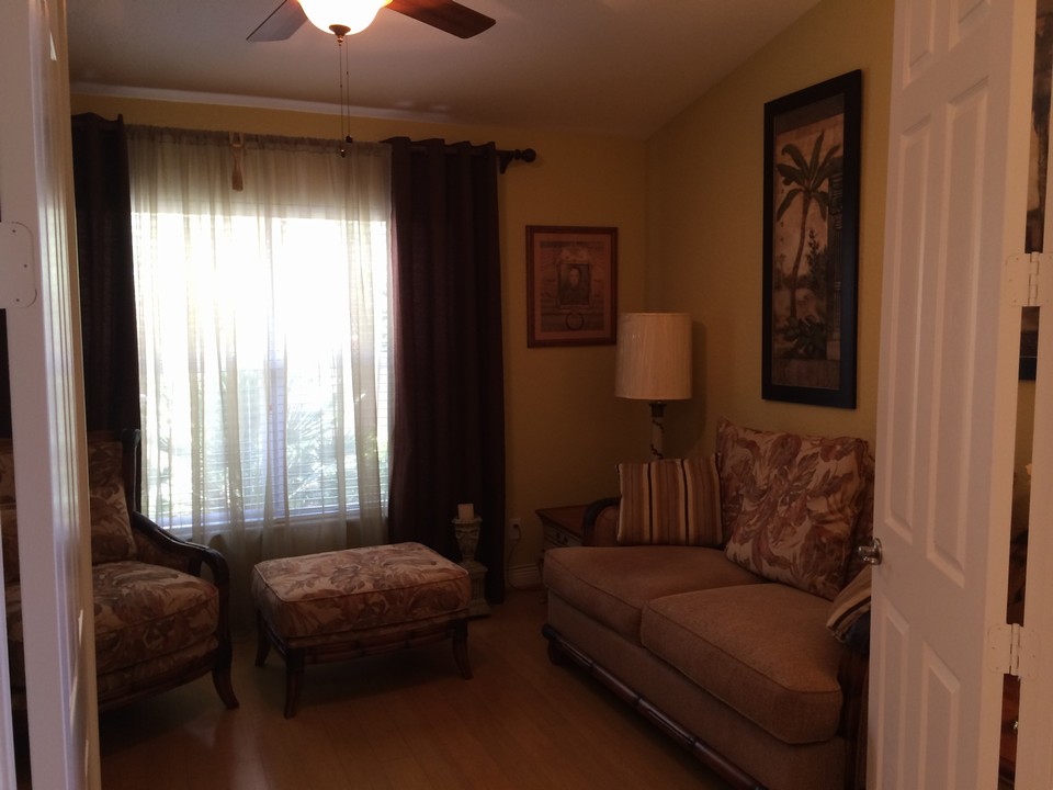 den/office/guest bedroom with bamboo flooring & double doors