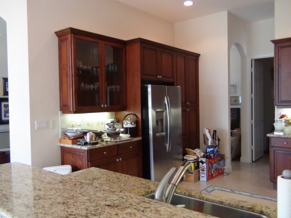 glass cabinet, crown molding and under-mount lights