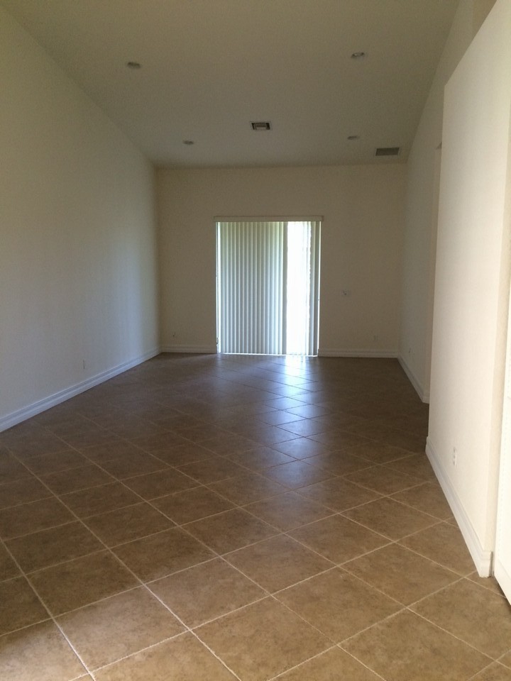 great room with slider opening to covered patio